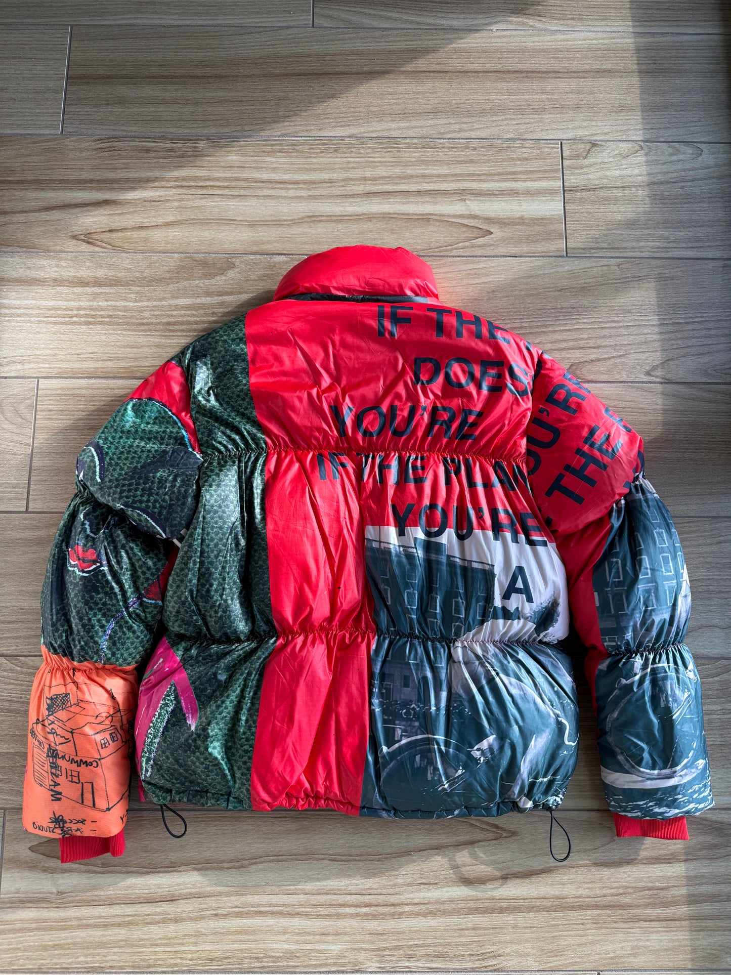 KidSuper Studios “Genius Collage” Puffer Jacket