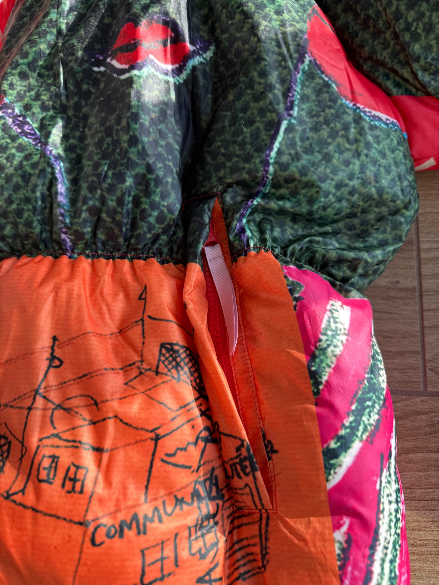 KidSuper Studios “Genius Collage” Puffer Jacket
