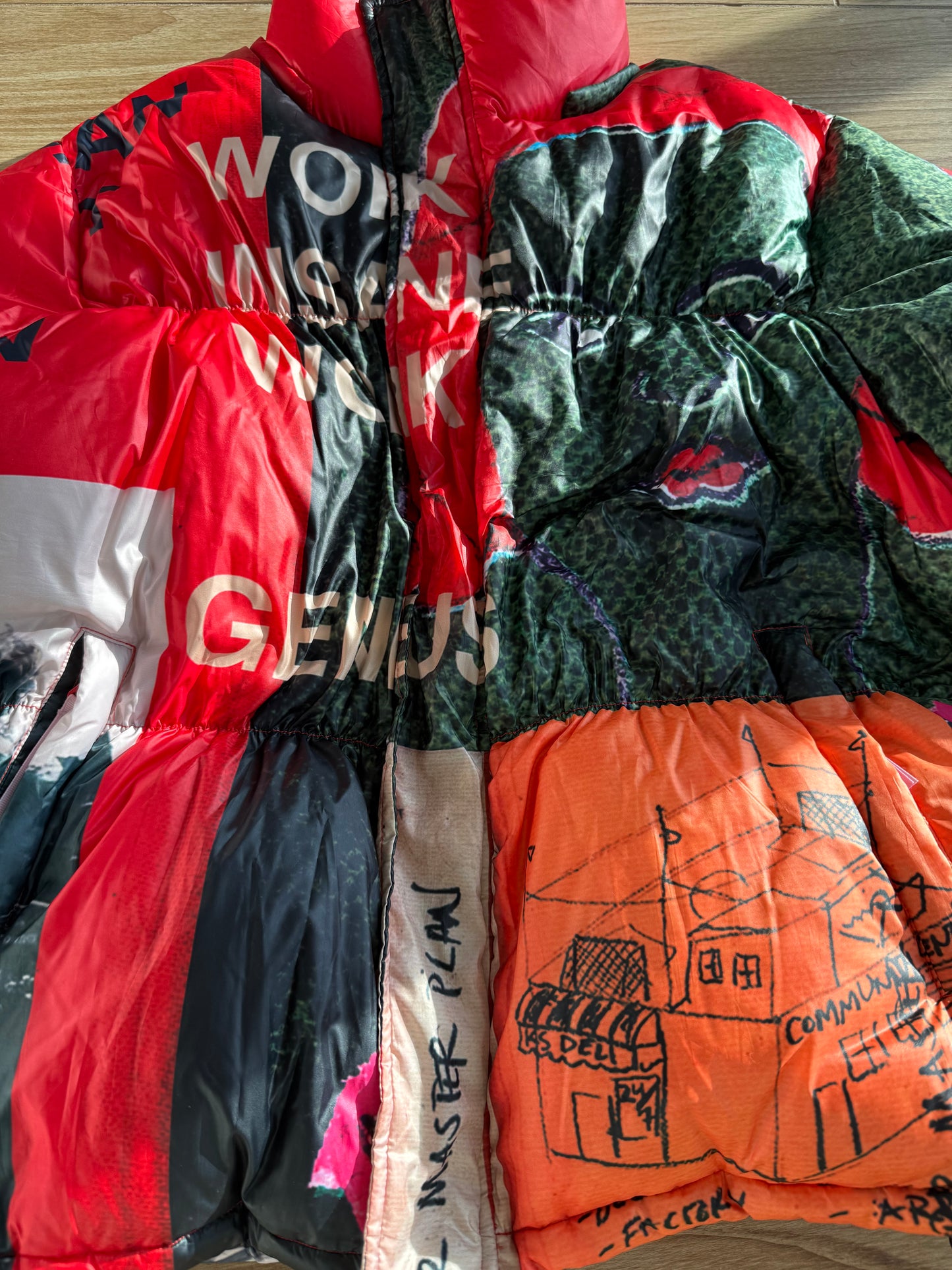 KidSuper Studios “Genius Collage” Puffer Jacket